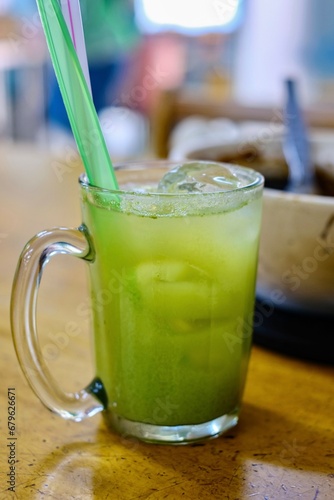 Canvas Print A glass of umbra (kedondong) juice with sour plum at Heun Kee Claypot Rice, a Ch
