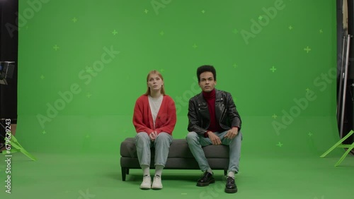 GREEN SCREEN Multi-racial couple pretending they are visiting a museum or art exhibition  (ID: 679629243)