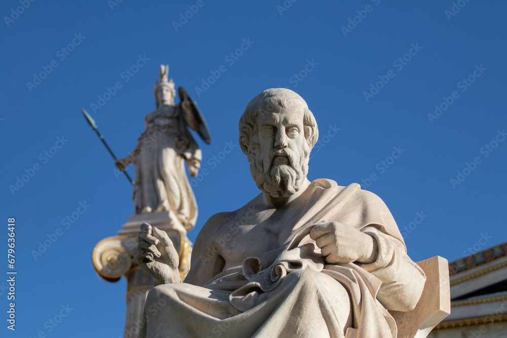 Marble statue of Greek philosopher Plato. Goddess Athena on background.