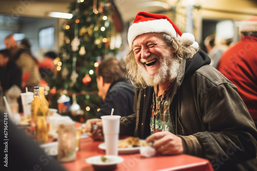 A homeless person enjoying a meal in a charity food bank kitchen during the christmas holidays
