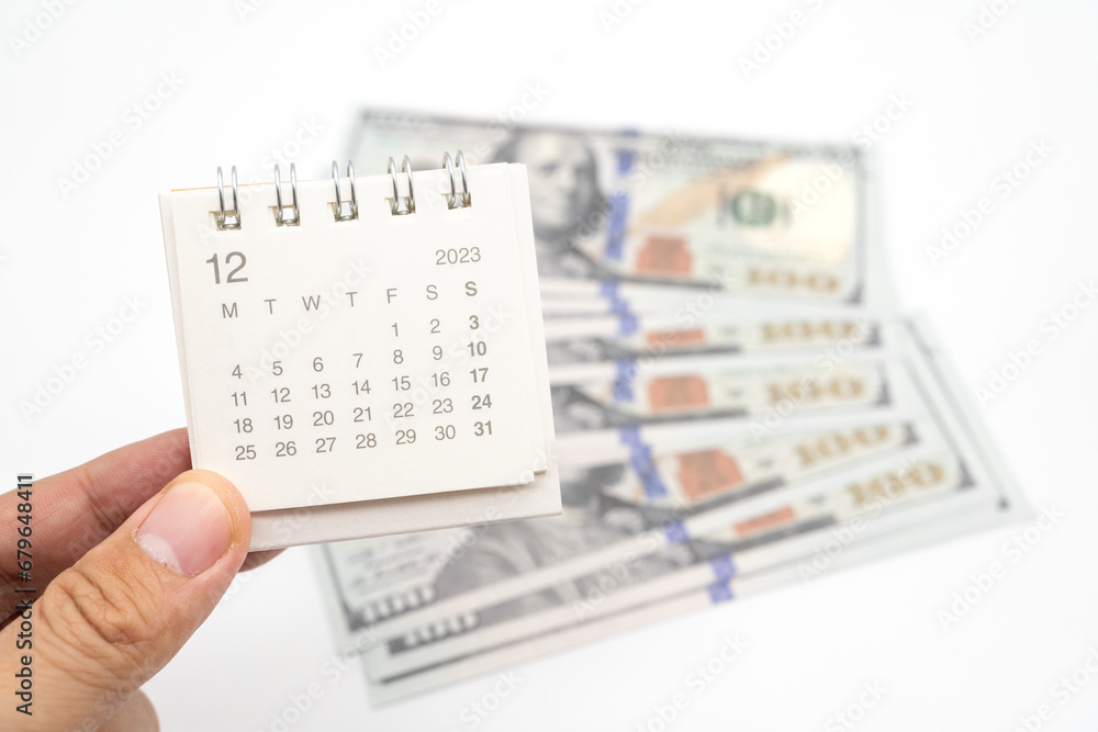 Obraz premium Envelope With Money And Calendar. opens envelope with money, dollars. Pension Concept. Bonus Money. isolated on white background.