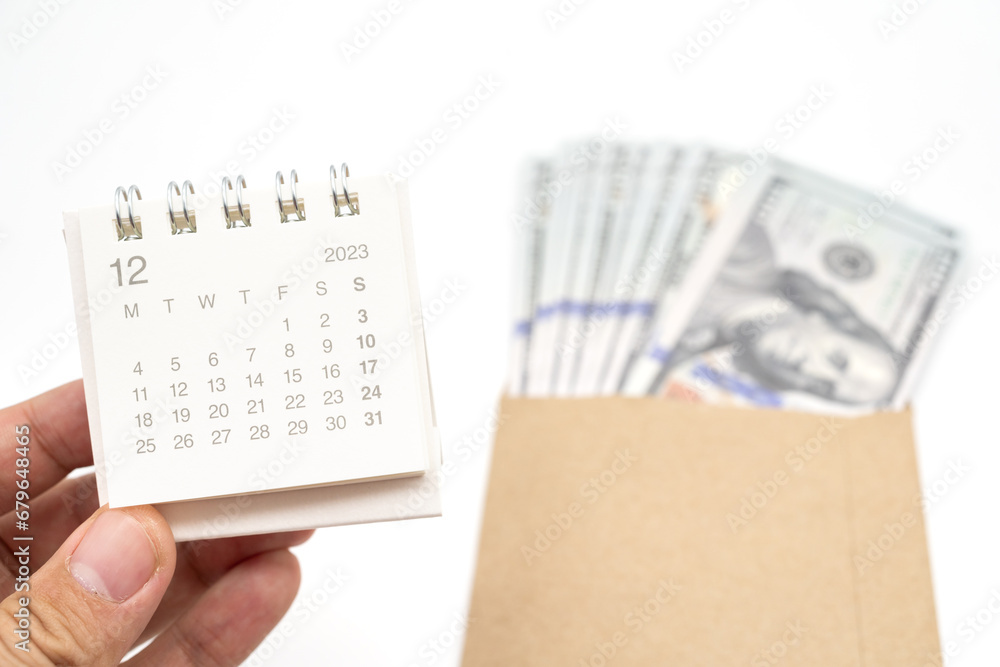 Obraz premium Envelope With Money And Calendar. opens envelope with money, dollars. Pension Concept. Bonus Money. isolated on white background.
