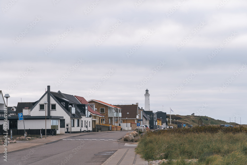 Residential houses and Hirtshals fyr (lighthouse) in a Hirtshals landscape (Jutland, Nordjylland, northern Denmark), a town known for fishing and ferry terminal.