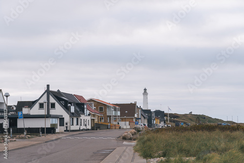 Obraz na płótnie Residential houses and Hirtshals fyr (lighthouse) in a Hirtshals landscape (Jutland, Nordjylland, northern Denmark), a town known for fishing and ferry terminal. w salonie
