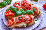 Chicken fillets baked with mozzarella, tomatoes and basil
