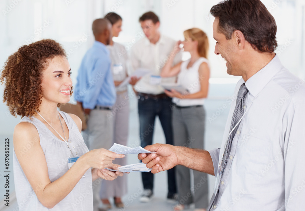 Business people, team and secretary giving paper to man for information in startup office, seminar or convention. Happy professional, documents and conference, workshop meeting or creative training Business people, team and secretary giving paper to man for information in startup office, seminar or convention. Happy professional, documents and conference, workshop meeting or creative training