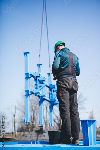 Manual worker working at shipyard construction site