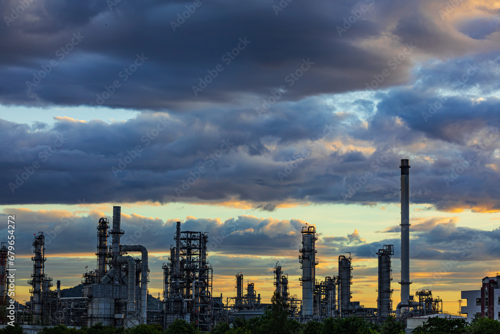 Fototapeta premium Oil​ refinery​ plant and tower of Petrochemistry industry in oil​ and​ gas​ ​industry with​ cloud​ blue​ ​sky