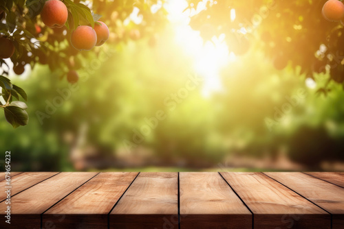 empty wooden table in sunny apple garden