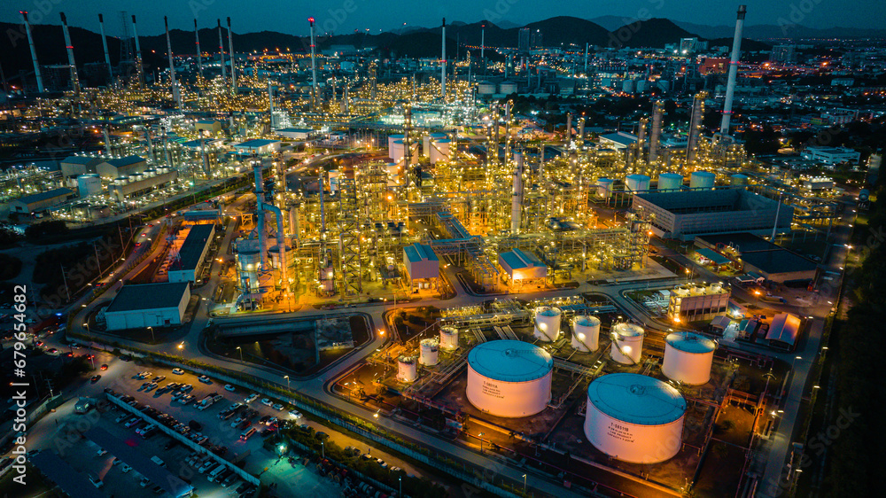 Aerial view of the morning of oil refinery from the drone of tower of Petrochemistry industry in oil​ and​ gas​ ​industry with​ cloud