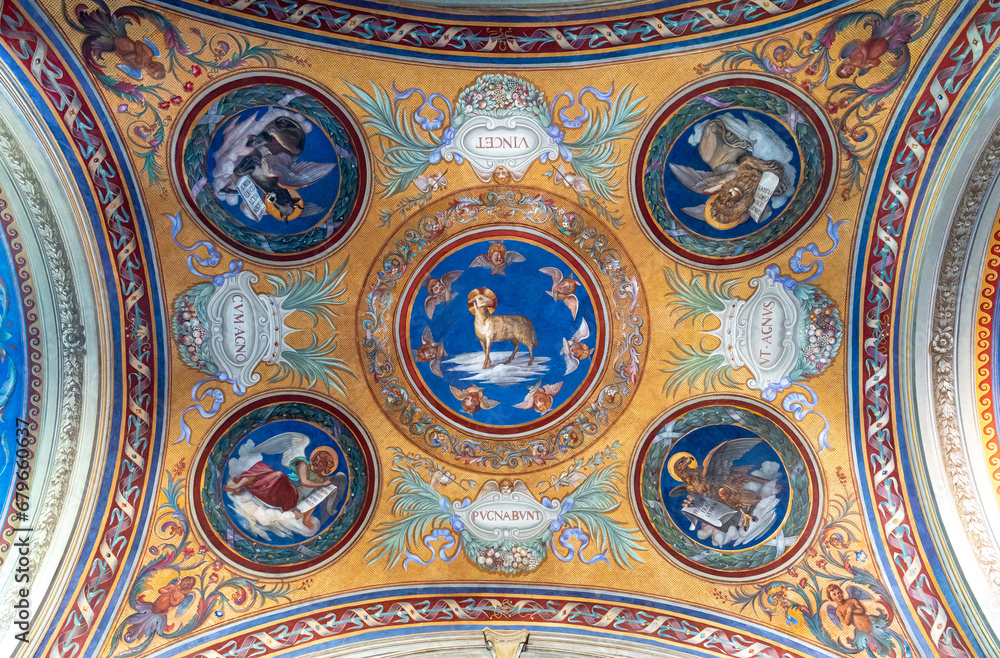Detail of frescos painted inside circles decorating a cathedral ceiling in Rome