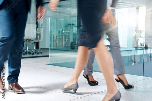 Business people  busy or legs walking in office in commute to travel together for work or job. Closeup  shoes or group of employees in lobby of workplace with suit  blur or fast and corporate staff