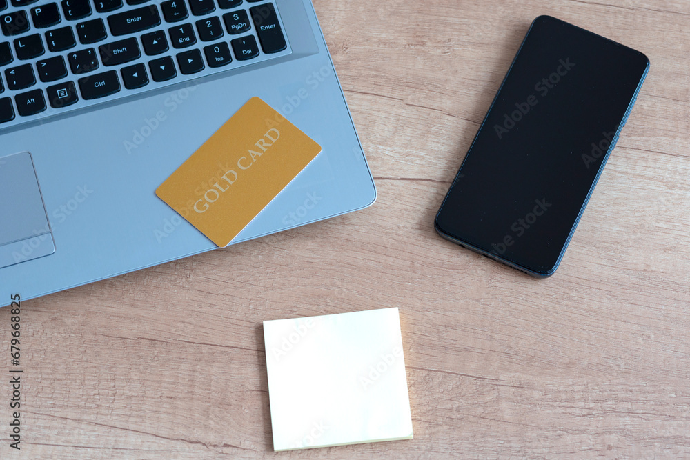 laptop, card, smartphone, notes. laptop, card, smartphone, notes.