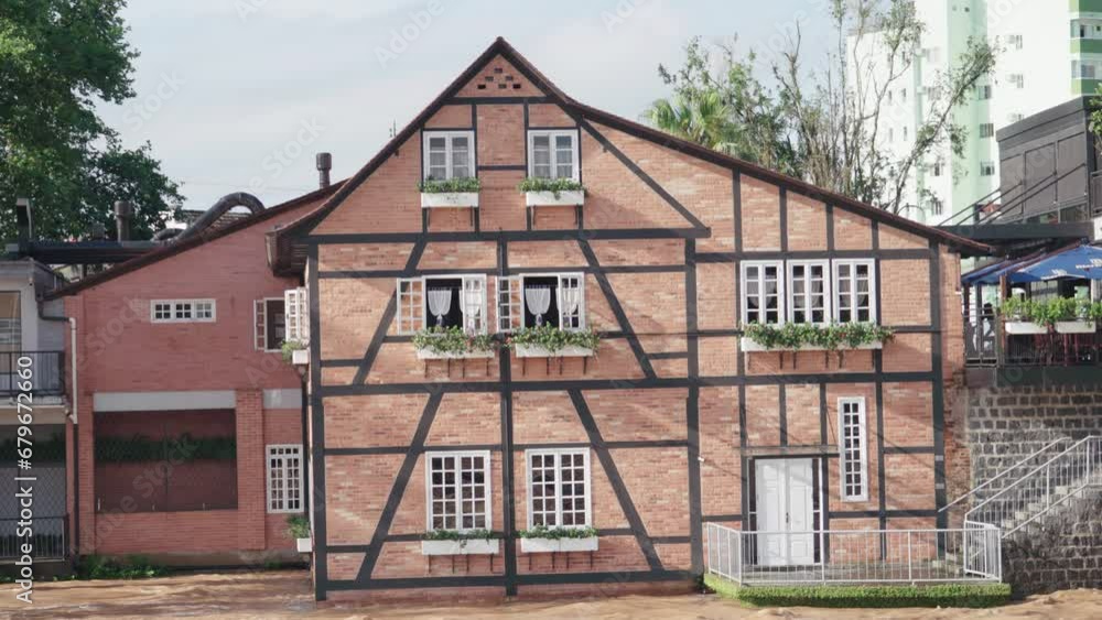 A half-timbered house on top of a river high in the spring rains
A half-timbered house on top of a river high in the spring rains