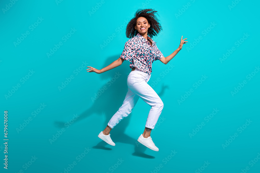 Full length photo of good mood positive girl run empty space hurry buy clothes black friday offer isolated on cyan color background