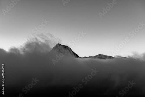 Mountain Peak San Salvatore Above Cloudscape with Sunlight and Clear Sky in Lugano, Ticino in Switzerland.