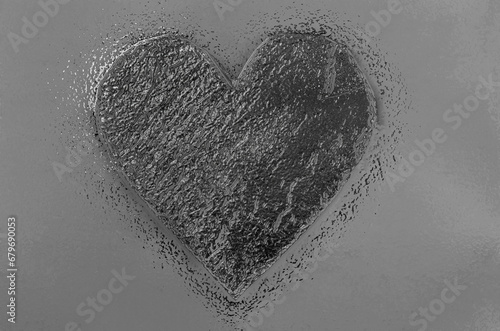image of a heart in gray tones with a chrome surface texture