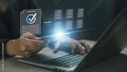 Document management performance checklist, businessman using checklist survey online. Manager is verifying the validity, security, approving, quality assurance by checkmark selection document.