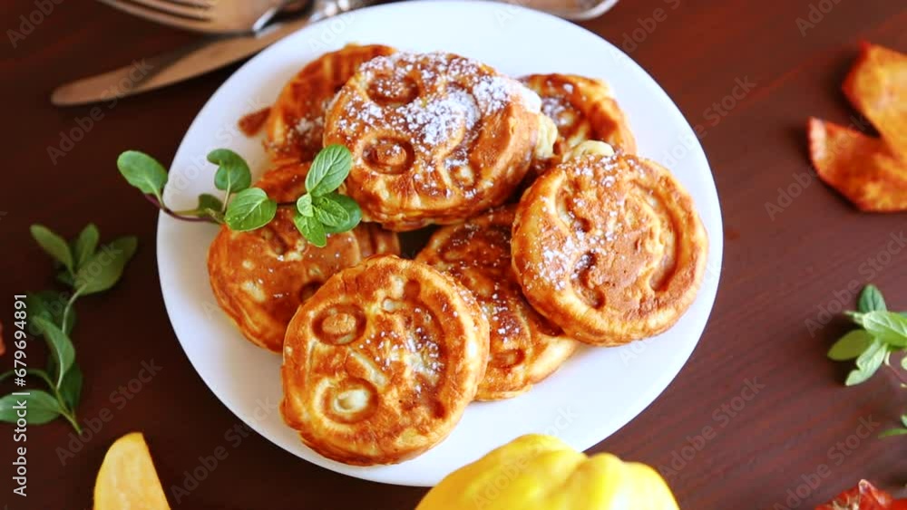 Cooked fried round pancakes with quince filling on a wooden table Cooked fried round pancakes with quince filling on a wooden table