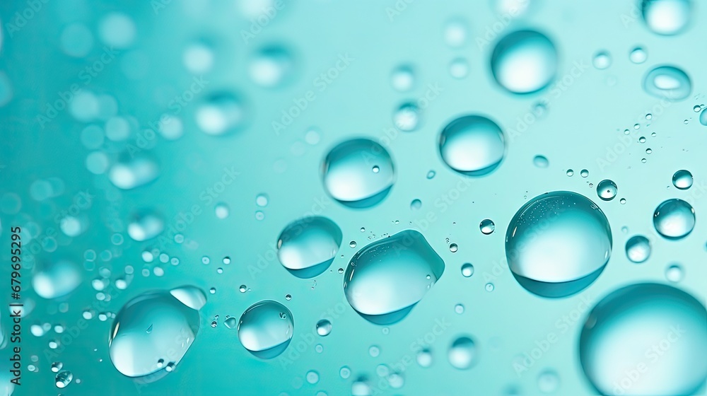  a close up of water droplets on a blue surface with a light green backgrounnd and a light blue backgrounnd.