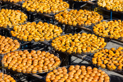Dry Persimmon fruit production under sunshine in factory