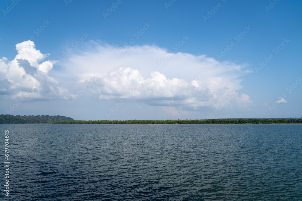 Beautiful panoramic view of Xingu river in the Amazon rainforest on sunny summer day with blue sky. Para state, Brazil. Concept of nature, ecology, climate, climate change, and environment.	
