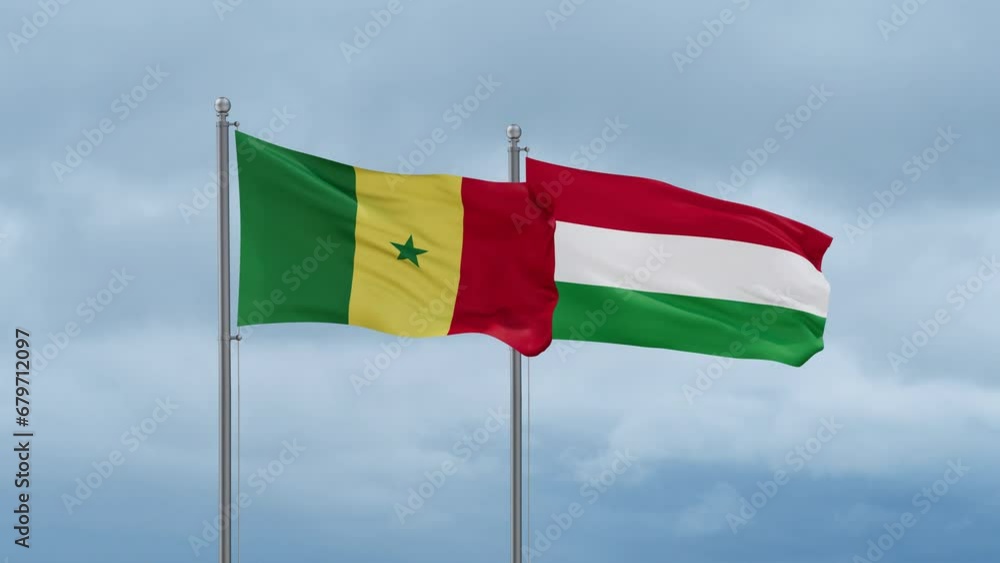 Hungary flag and Senegal flag waving together on cloudy sky, endless seamless loop, two country relations concept Hungary flag and Senegal flag waving together on cloudy sky, endless seamless loop, two country relations concept