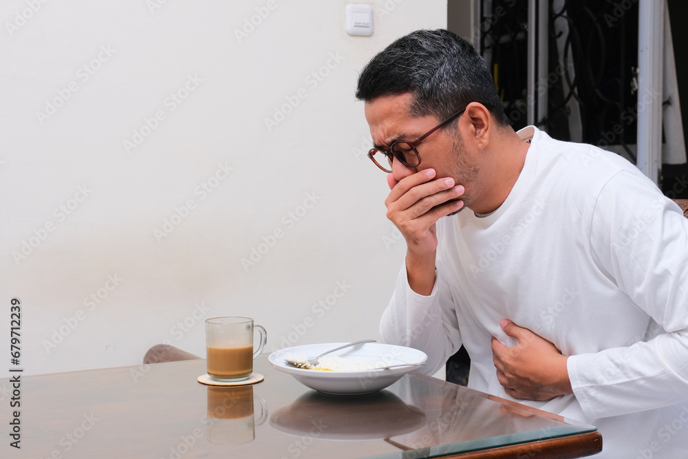 A man get nauseous when eating food A man get nauseous when eating food