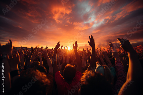 A vibrant scene capturing the energy of a large audience, joyously waving their hands in sync with the music at a lively concert. Ai generated © dragomirescu