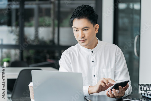 Hand businessman doing finances and calculate on desk about cost at office.