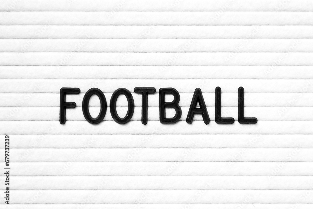 Black color letter in word football on white felt board background