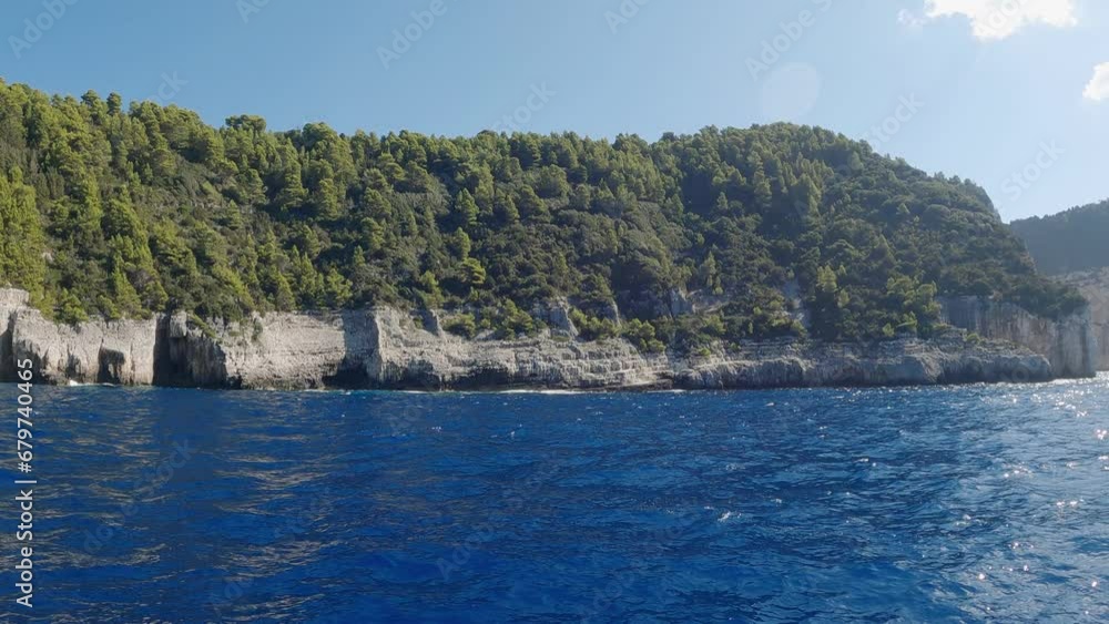 Pov boat sail with view of amazing rocky coastline of Paxos island in Greece Pov boat sail with view of amazing rocky coastline of Paxos island in Greece