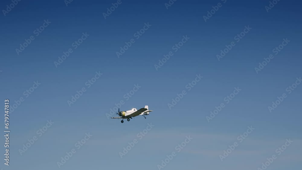Small propelier tourist plane fly on blue sky aproaching the Corfu island, Greece during landing procedure in slow motion Small propelier tourist plane fly on blue sky aproaching the Corfu island, Greece during landing procedure in slow motion