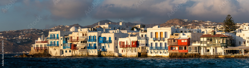 Obraz premium Panoramic view of Little Venice Mykonos (Chora), Cyclades Islands, Aegean Sea, Greece. Wterfront with rows of fishing houses line the waterfront with their balconies hanging over the sea.