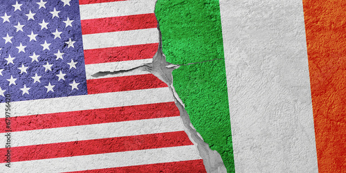 USA and Ireland flags on a stone wall with a crack, illustration of the concept of a global crisis in political and economic relations