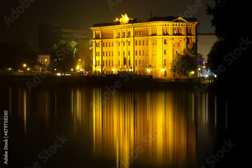 Illuminated Building with Reflection on Water. Building at night. High quality photo