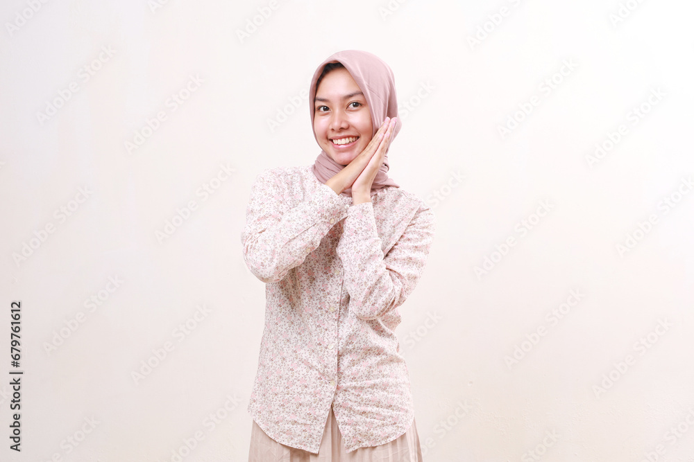 Cheerful young asian muslim woman standing with wow surprised face. Isolated on white background Cheerful young asian muslim woman standing with wow surprised face. Isolated on white background