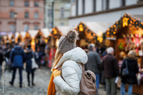 Woman is enjoying the Christmas market in city during the Advent holiday