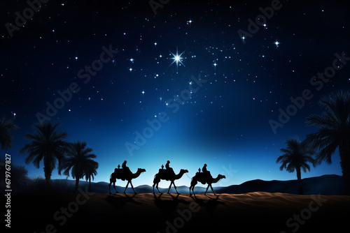 Silhouette of the three wise men traveling on camels to Bethlehem for the birth of baby Jesus photo