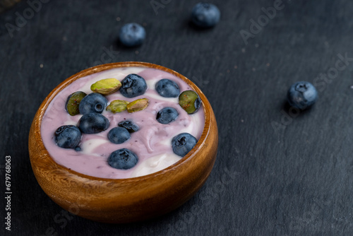 fresh purple and white yogurt with blueberries and blueberry berry flavor