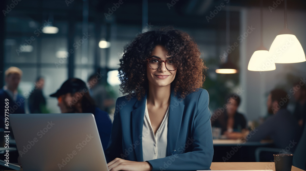 Close up portrait of young beautiful woman smiling while working with laptop in office. - obrazy, fototapety, plakaty 