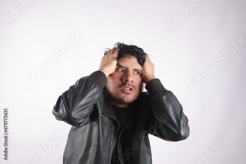 Photograph of person holding his head very annoying. Concept of emotions and stress.