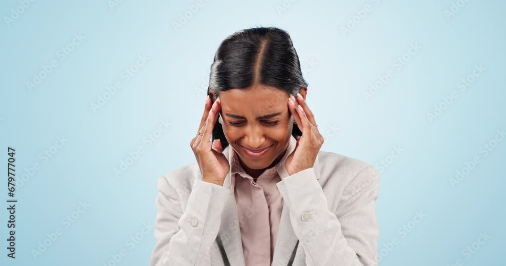 Headache, sick and business woman in studio for burnout, fatigue and financial crisis isolated on a blue background mockup space. Tired Indian worker massage temple for stress, pain and challenge. Headache, sick and business woman in studio for burnout, fatigue and financial crisis isolated on a blue background mockup space. Tired Indian worker massage temple for stress, pain and challenge.