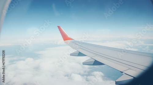 Airplane wing, scenic view from the window. Higher than clouds. Beautiful cloud, blue sky. Traveling by plane, adventure. Flight over world. Air transport. Aviation. Holiday, vacation. Generated AI