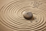 Zen sand garden meditation stone background. Balanced Stones and lines drawing in sand for relaxation. Concept of harmony, balance and meditation, spa, massage, relax.