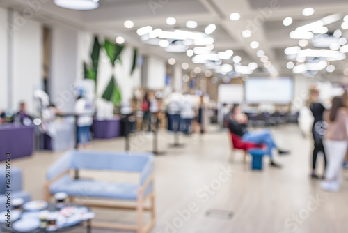 Blurred image of people in exhibition hall for background usage.Business concept