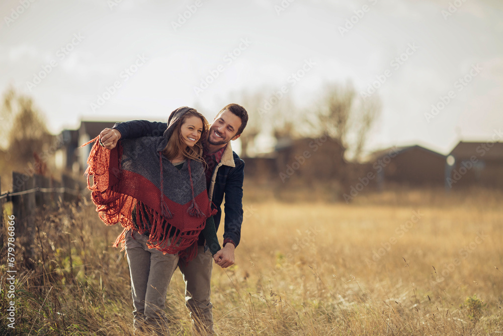 Young couple having serene walk in the countryside Young couple having serene walk in the countryside