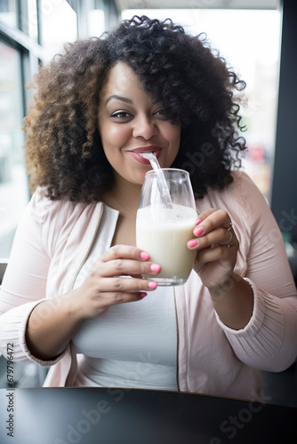 Savoring Sweetness: A Woman Relishing a Frothy Milkshake in a Cozy Cafe, ai generative