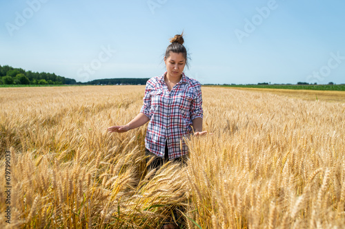 Farmer or agronomist inspect  wheat field