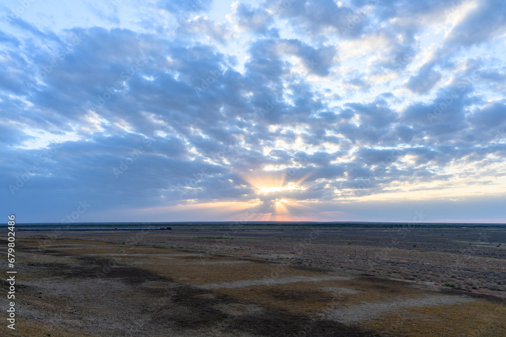 The Kazakh steppe with the dried plants in the desert.